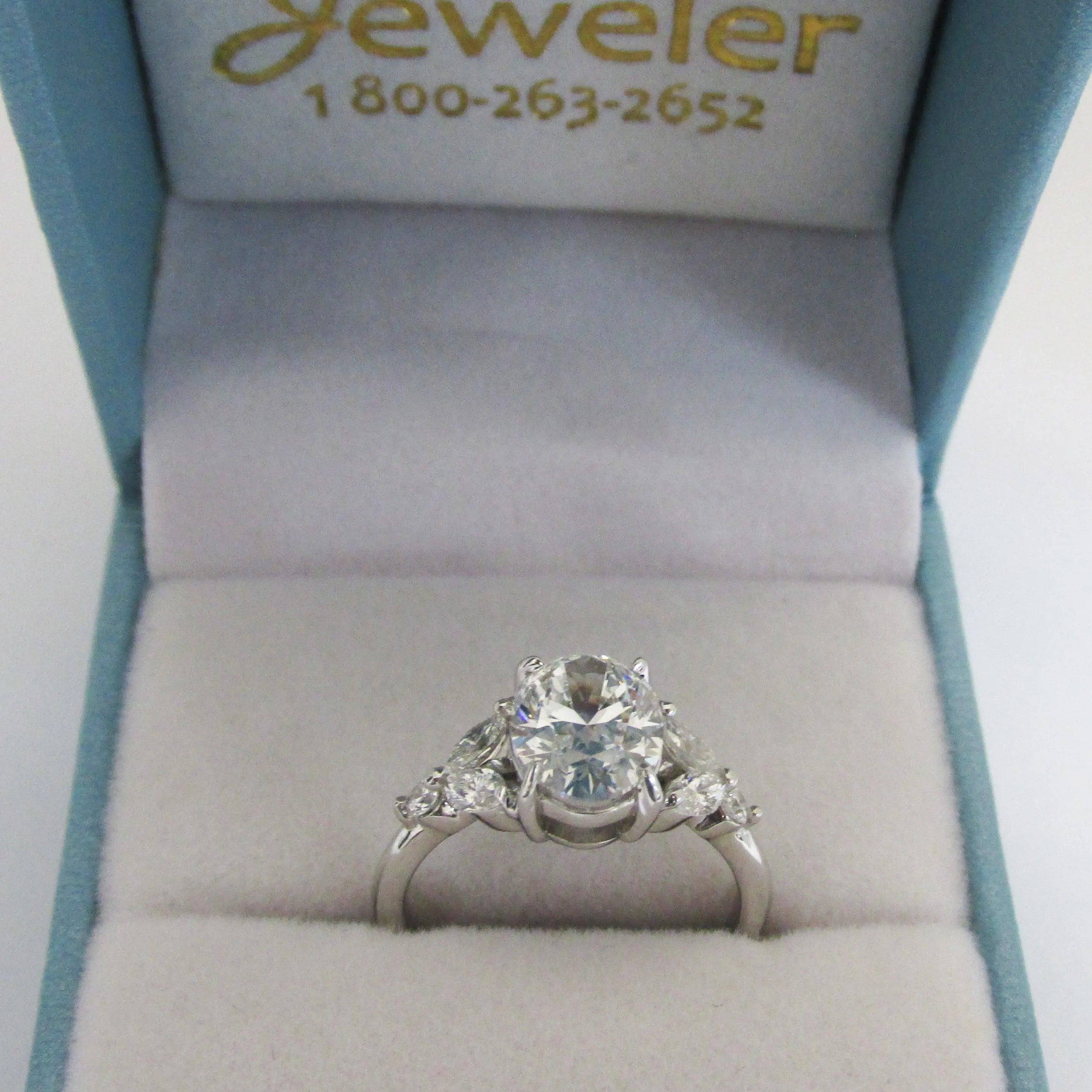 Oval Diamond and Marquise petals Engagement Ring
