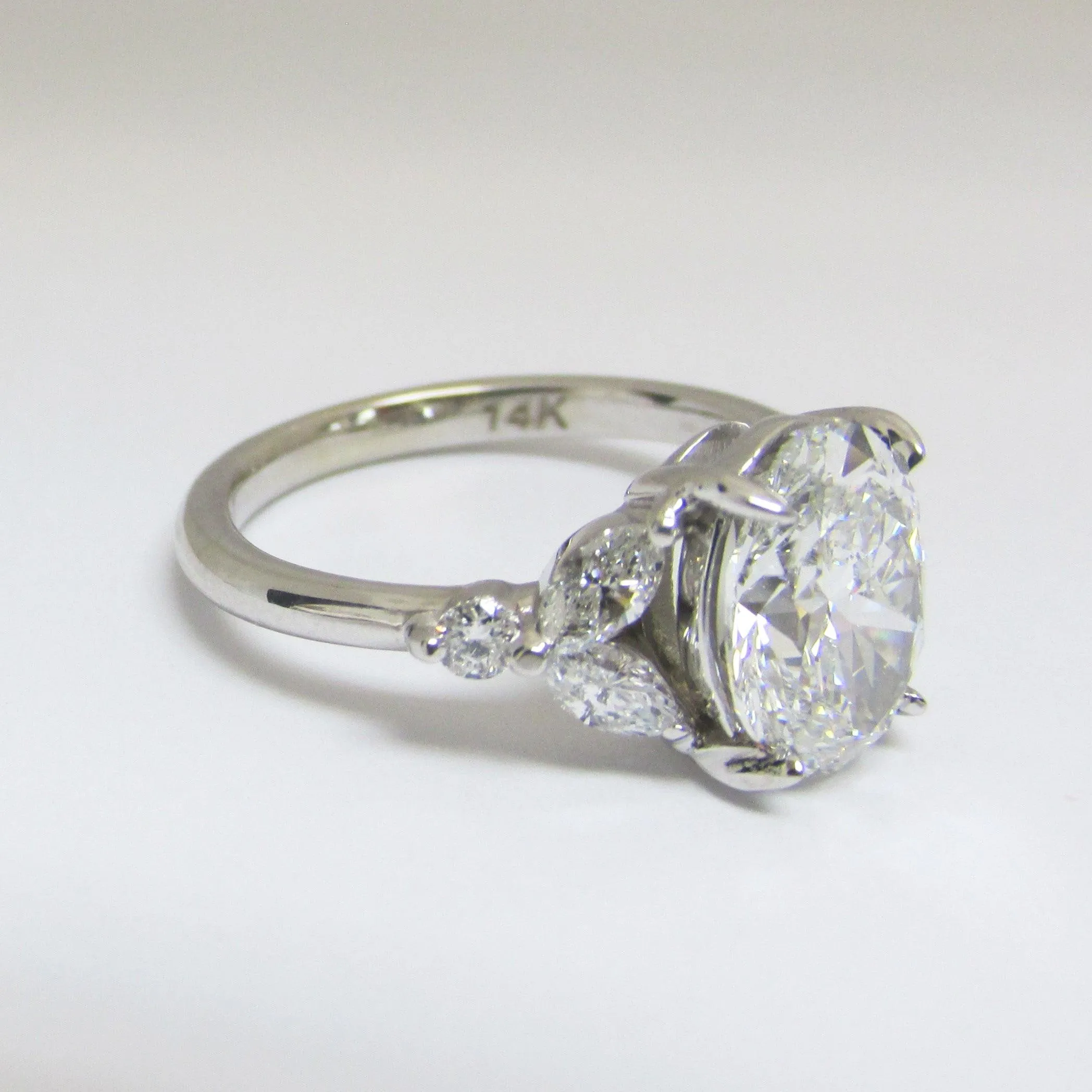 Oval Diamond and Marquise petals Engagement Ring