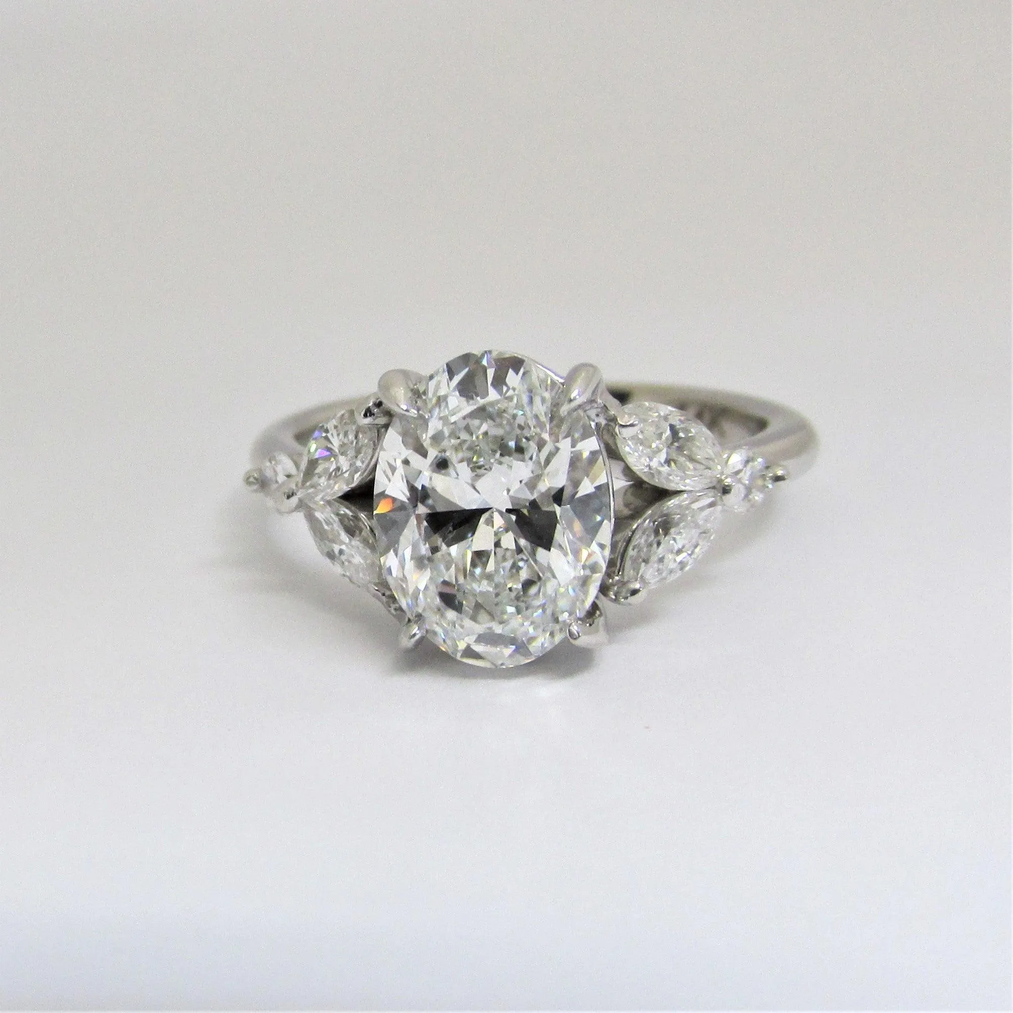 Oval Diamond and Marquise petals Engagement Ring