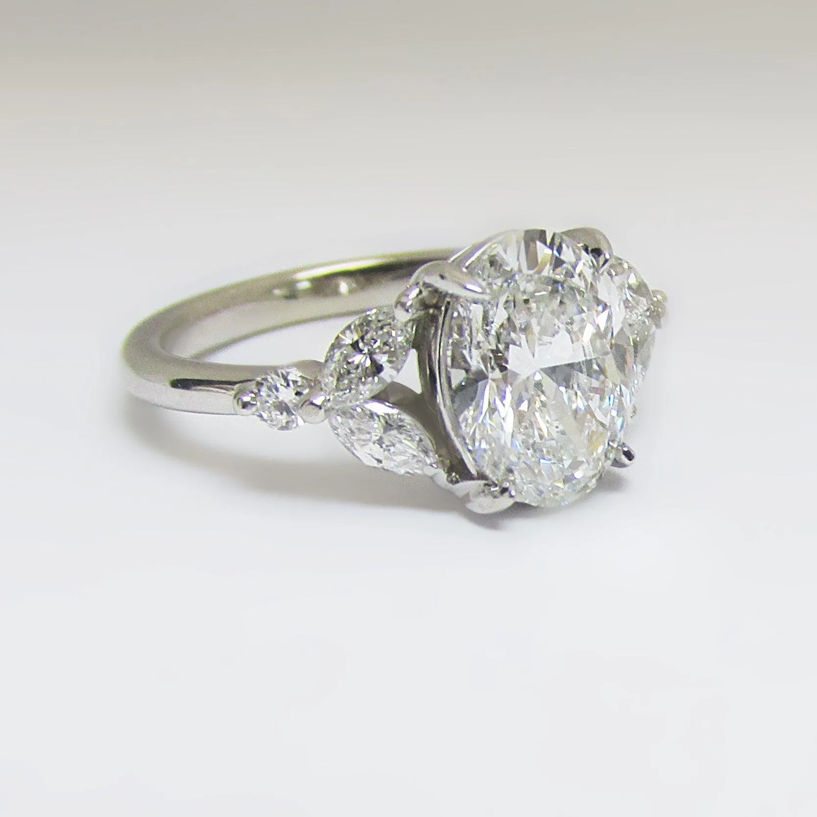 Oval Diamond and Marquise petals Engagement Ring