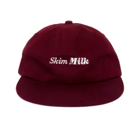 skim milk logo (maroon)